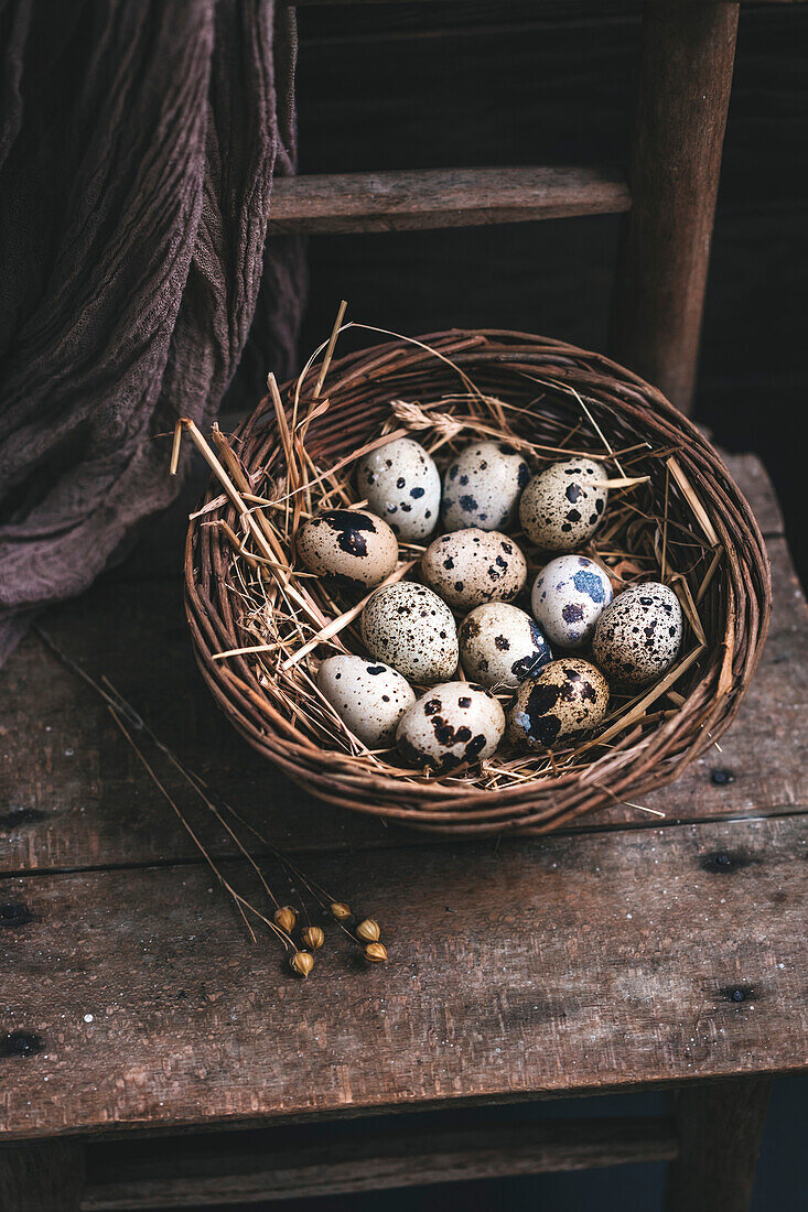 Fresh quail eggs in a basket