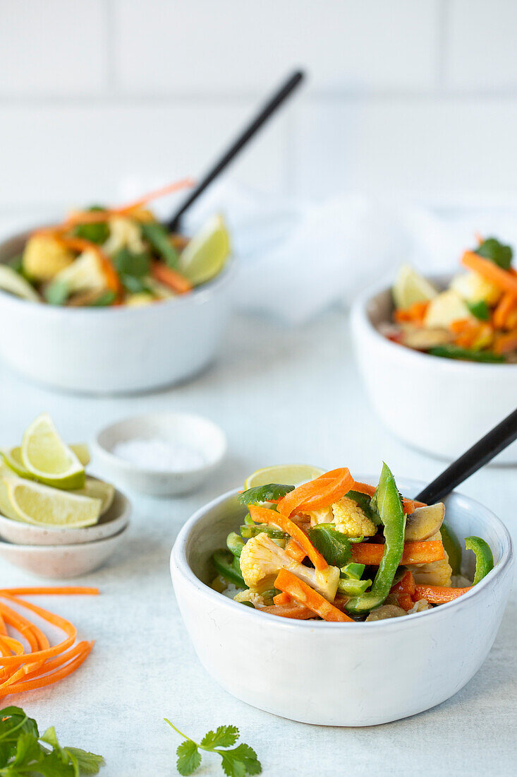 Coconut curry vegetables in a white bowl