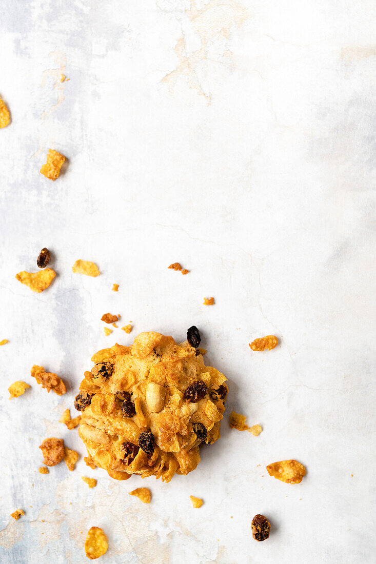 A crisp homemade cookie on a marble background.
