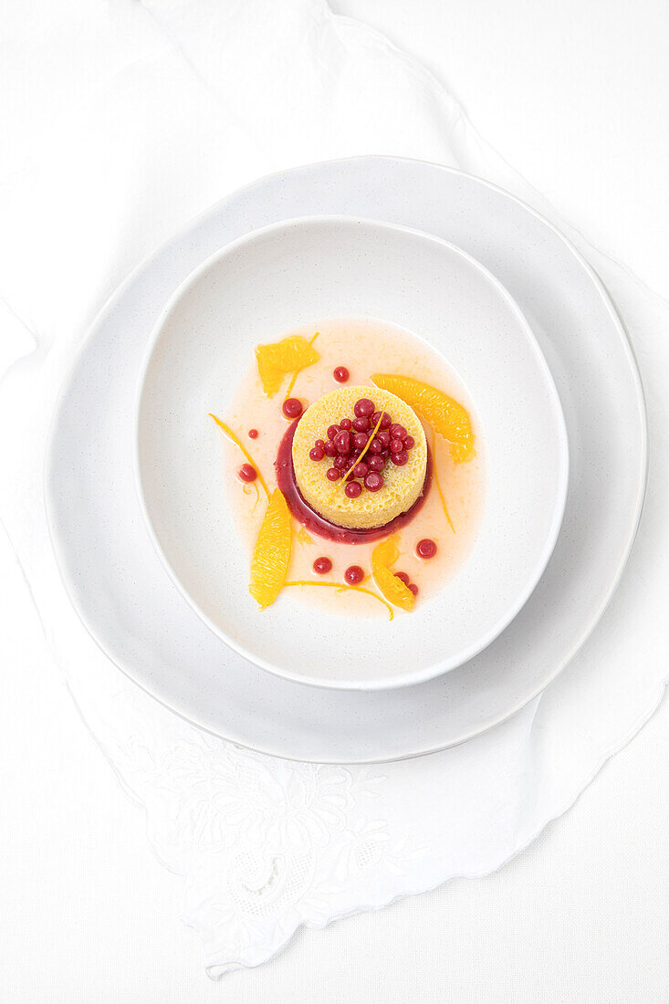 Tangerine gazpacho dessert in a white bowl