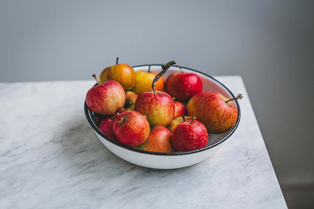Fresh ripe red apples in a bowl