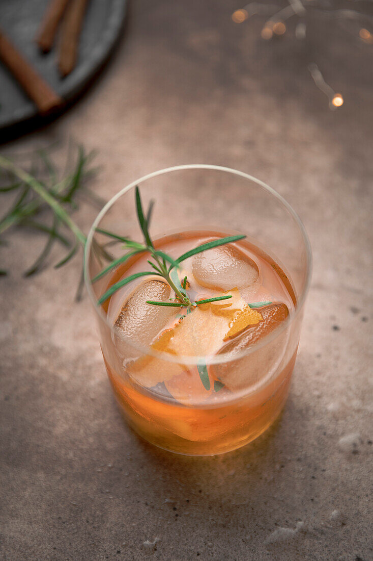 Old fashioned cocktail in a tumbler with bitters, whiskey and sugar