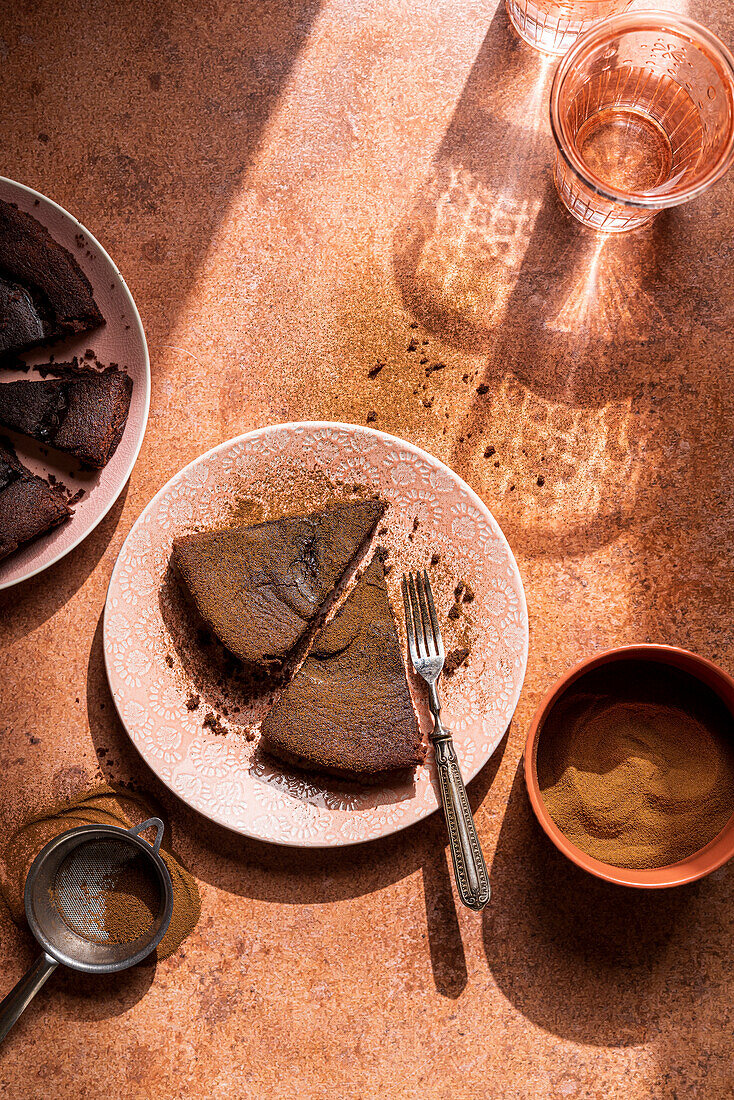 Slices of chocolate cake with cocoa powder
