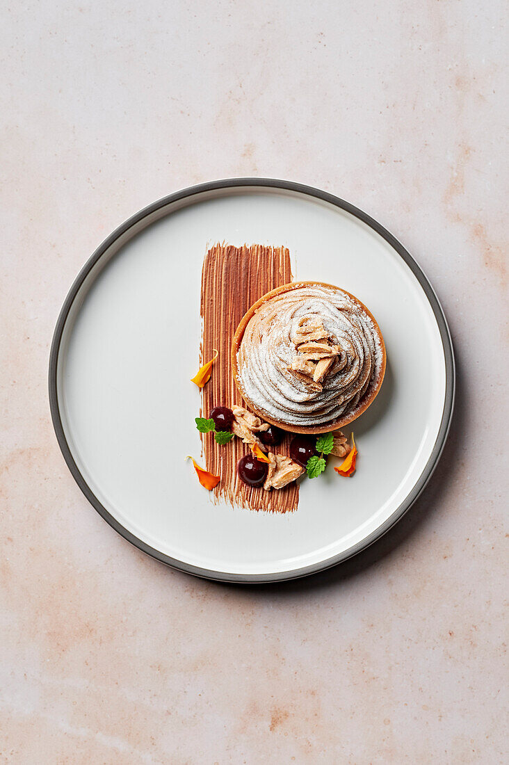 Frangipane and blackcurrant tart with chestnut cream and slivered almonds, from above