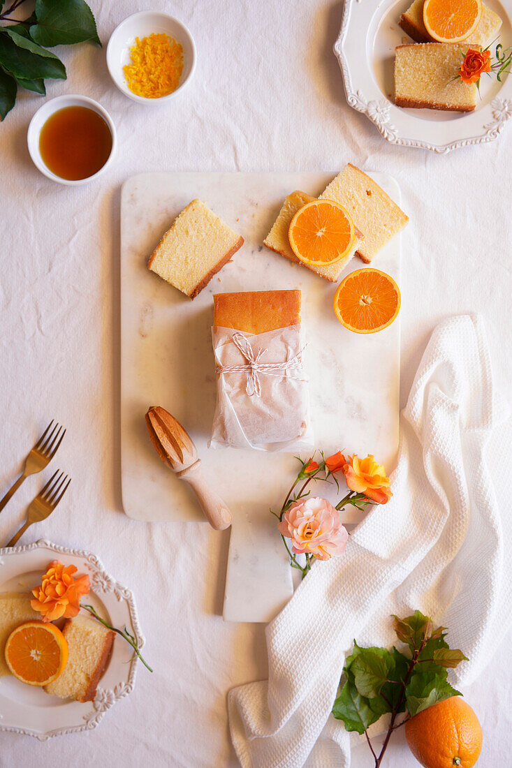 Orange Madeira cake with syrup and orange peel. Table decoration for afternoon tea Flatlay