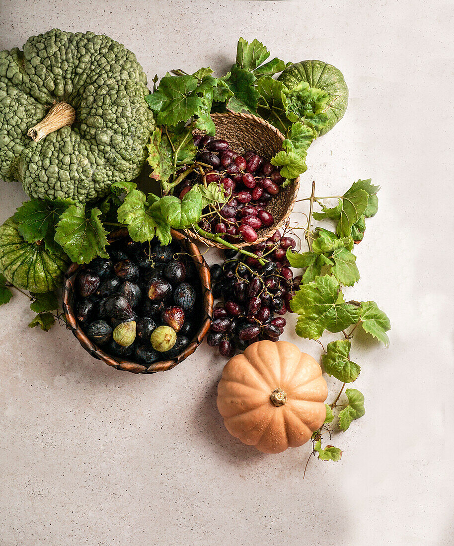 Autumn composition, grapes, figs, pumpkin, top view, concept of Halloween, Thanksgiving