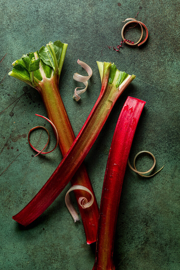 Rhubarb stalks on a green background