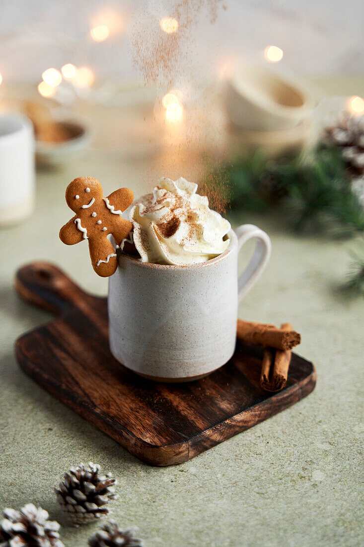 Hot chocolate with whipped cream, gingerbread and cinnamon