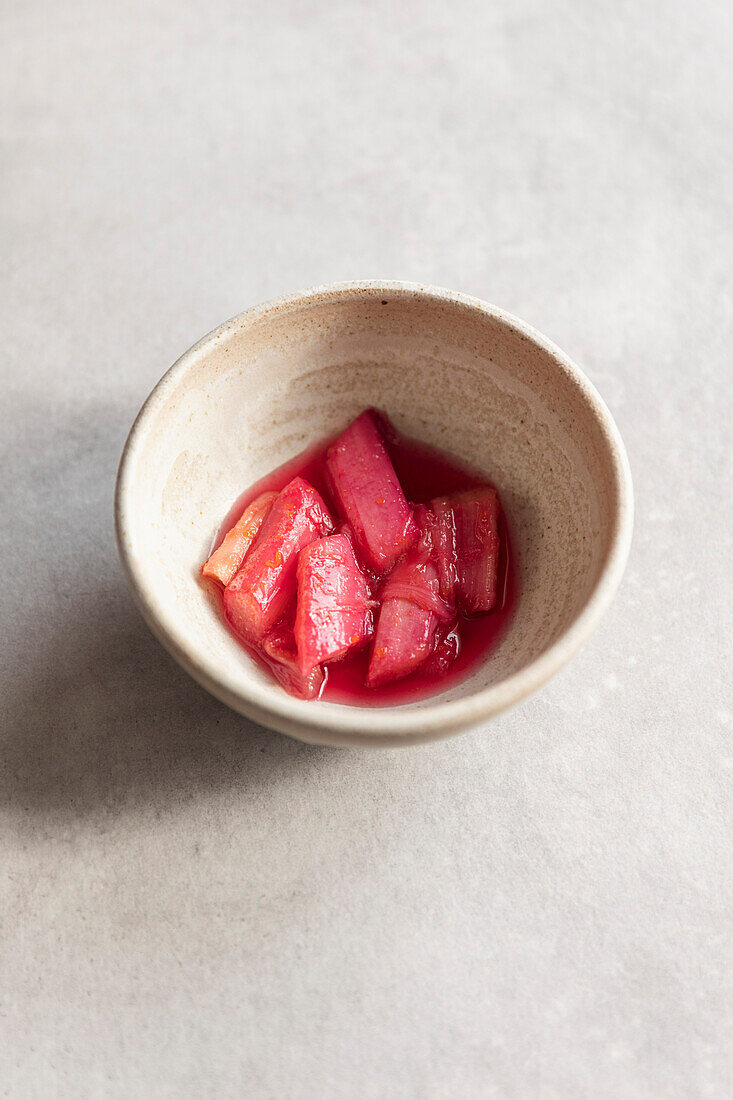 Steamed rhubarb in a ceramic bowl