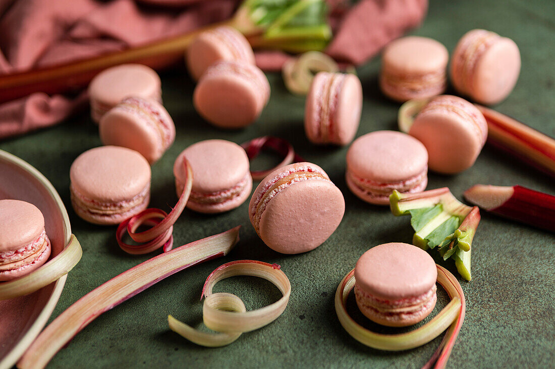 Rhubarb macarons on a green background