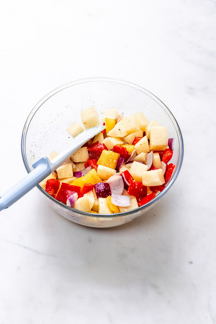 Roasted potatoes, peppers and onions in a bowl