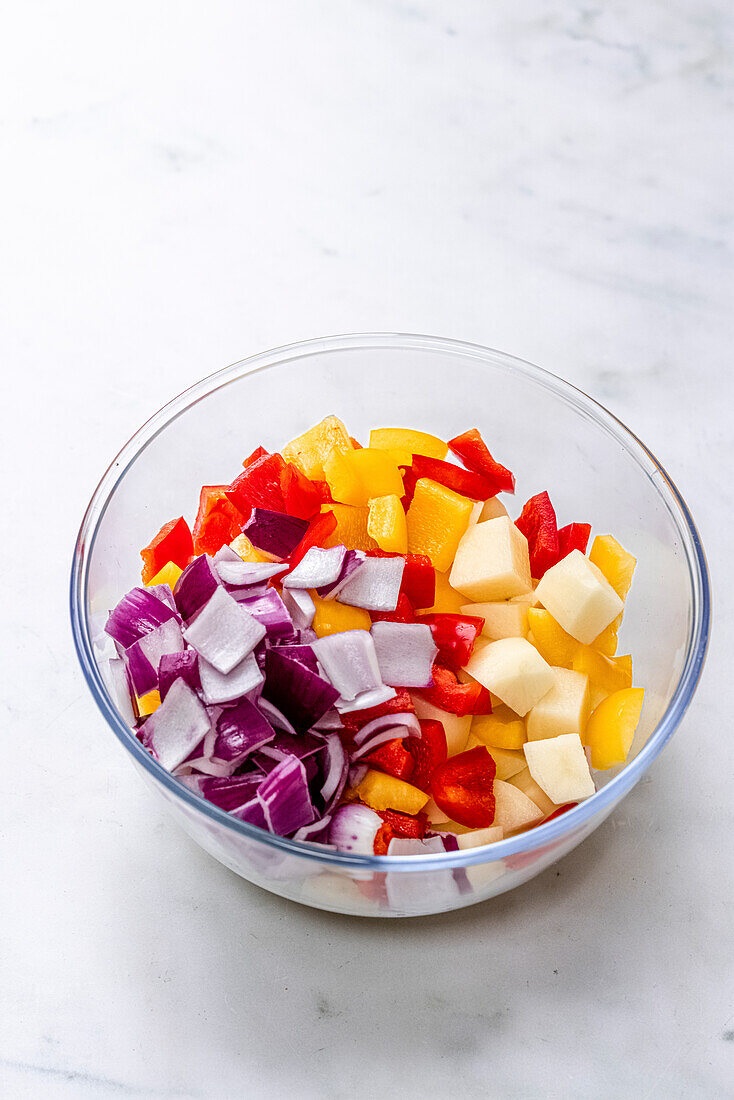 Roasted potatoes, peppers and onions in a bowl