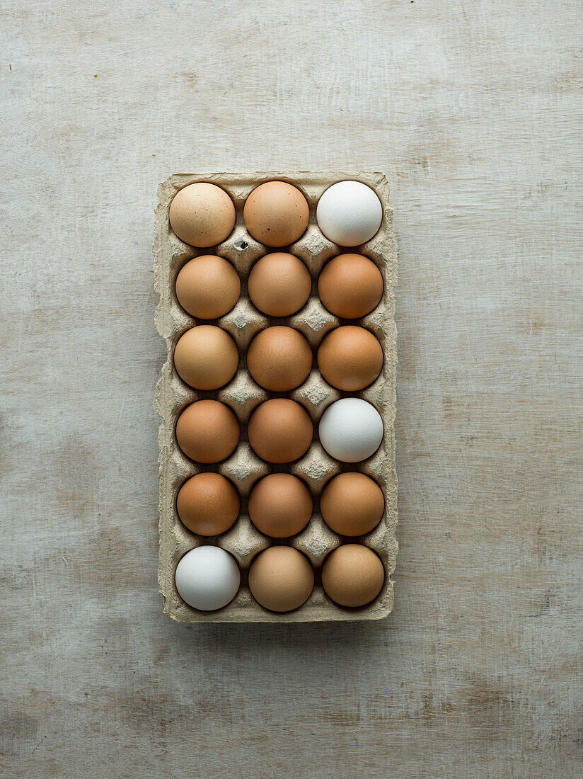 Raw eggs in a cardboard box