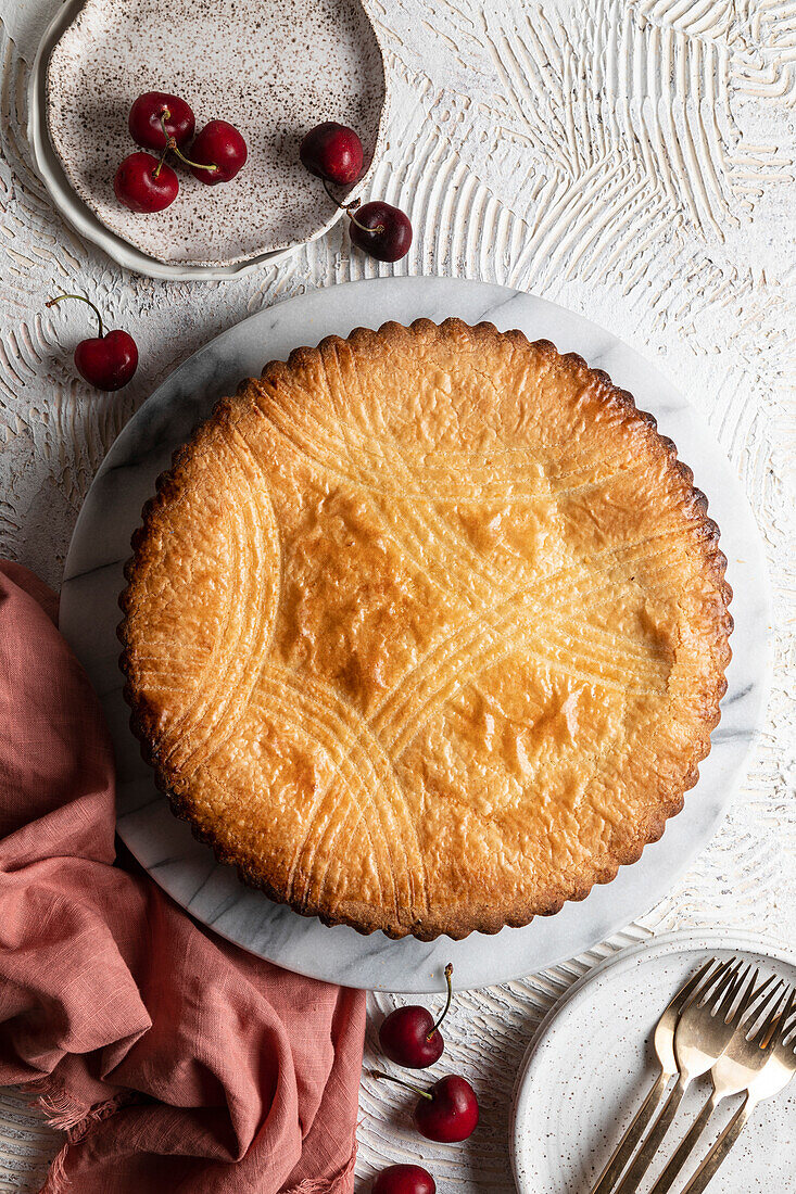 Basque tart with custard and cherry compote