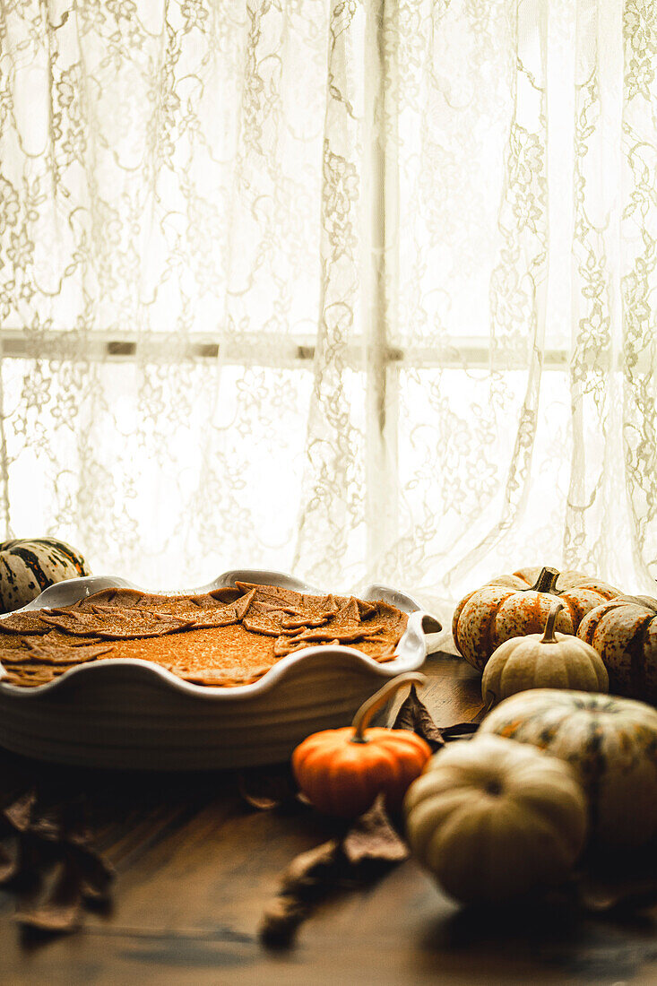 Pumpkin pie in a rustic kitchen