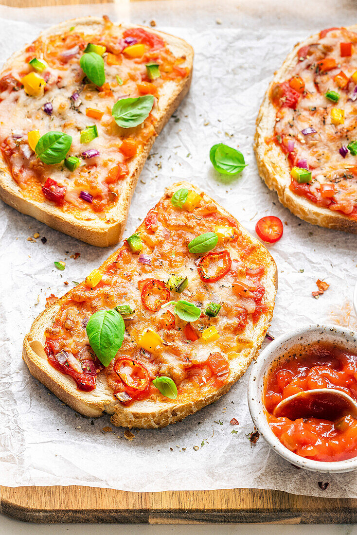 Cheese and tomato bread pizzas