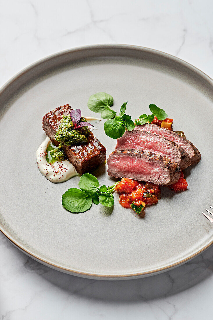 Grilled rack of lamb, pressed lamb shoulder, honey-lemon yoghurt, summer ratatouille, coriander-walnut salsa, chickpea sprouts