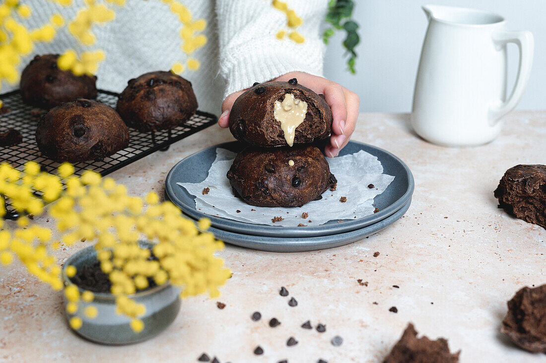 Chocolate bread with tahini spread on a table with yellow flowers