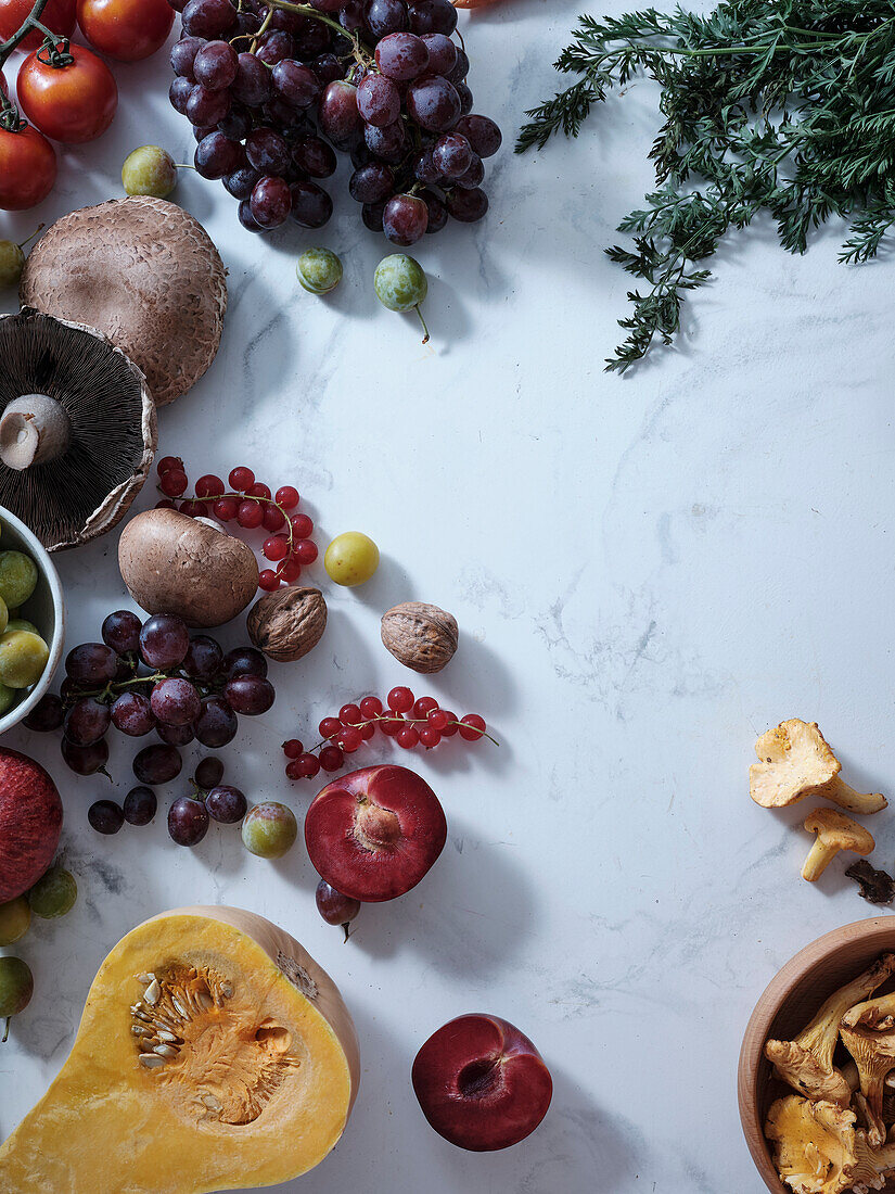 Healthy seasonal vegetarian meal. Flat plate of autumn vegetables, fruit and mushrooms from local market with text box. Vegan ingredients