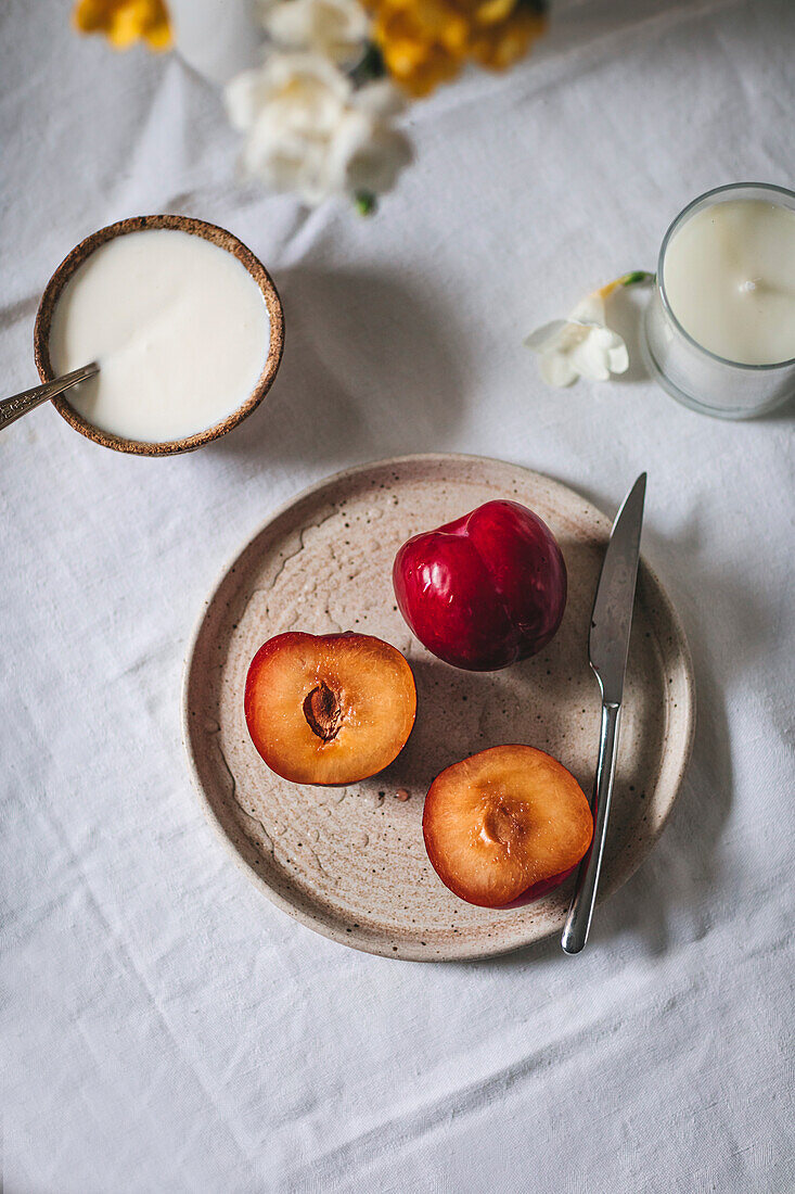 Plums on a ceramic plate on a table