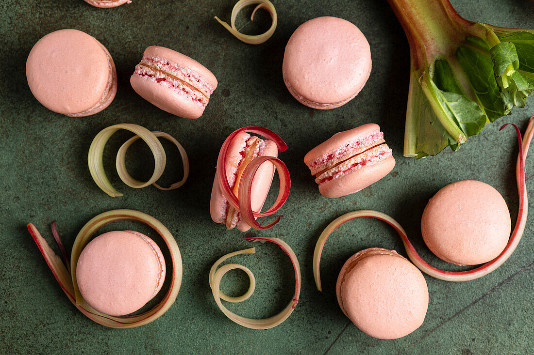 Rhubarb macarons on a green background