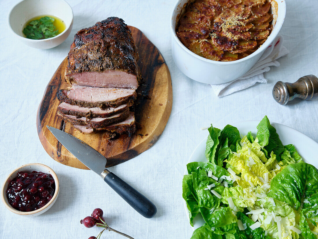 Dinner of slow roasted pork, potatoes and salad