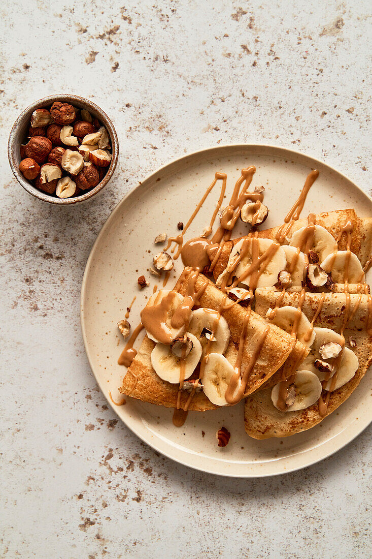 Banana, peanut butter and hazelnut crepes