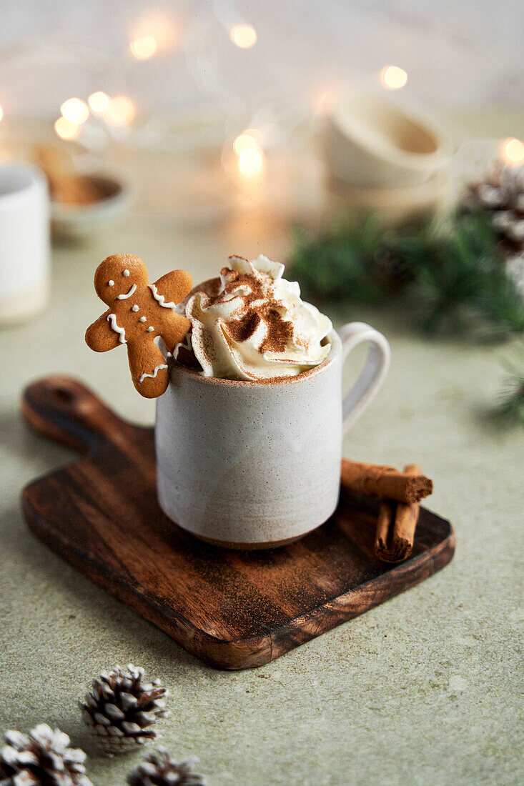Hot chocolate with whipped cream, gingerbread and cinnamon