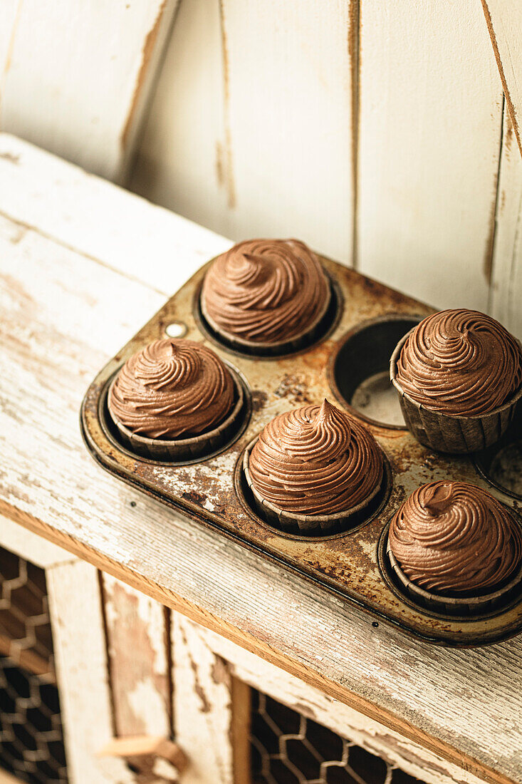 Chocolate cupcakes in a rustic kitchen
