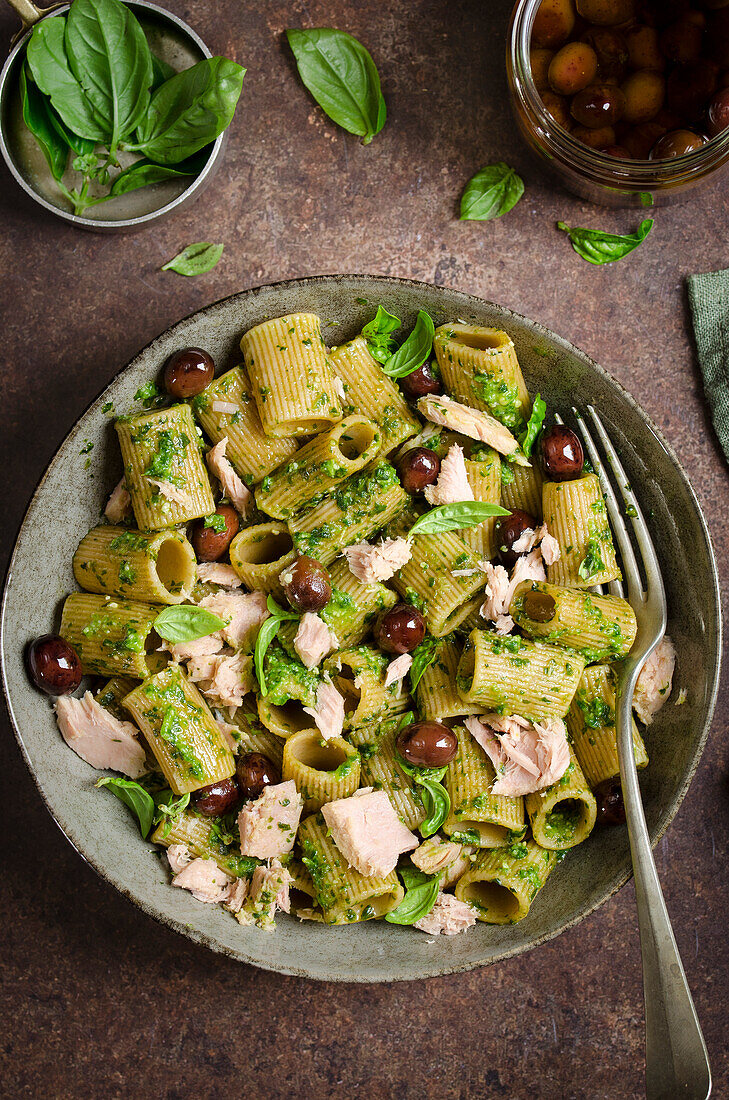 Pasta with pesto, olives and tuna