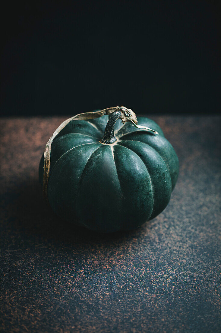 A pumpkin on a dark background