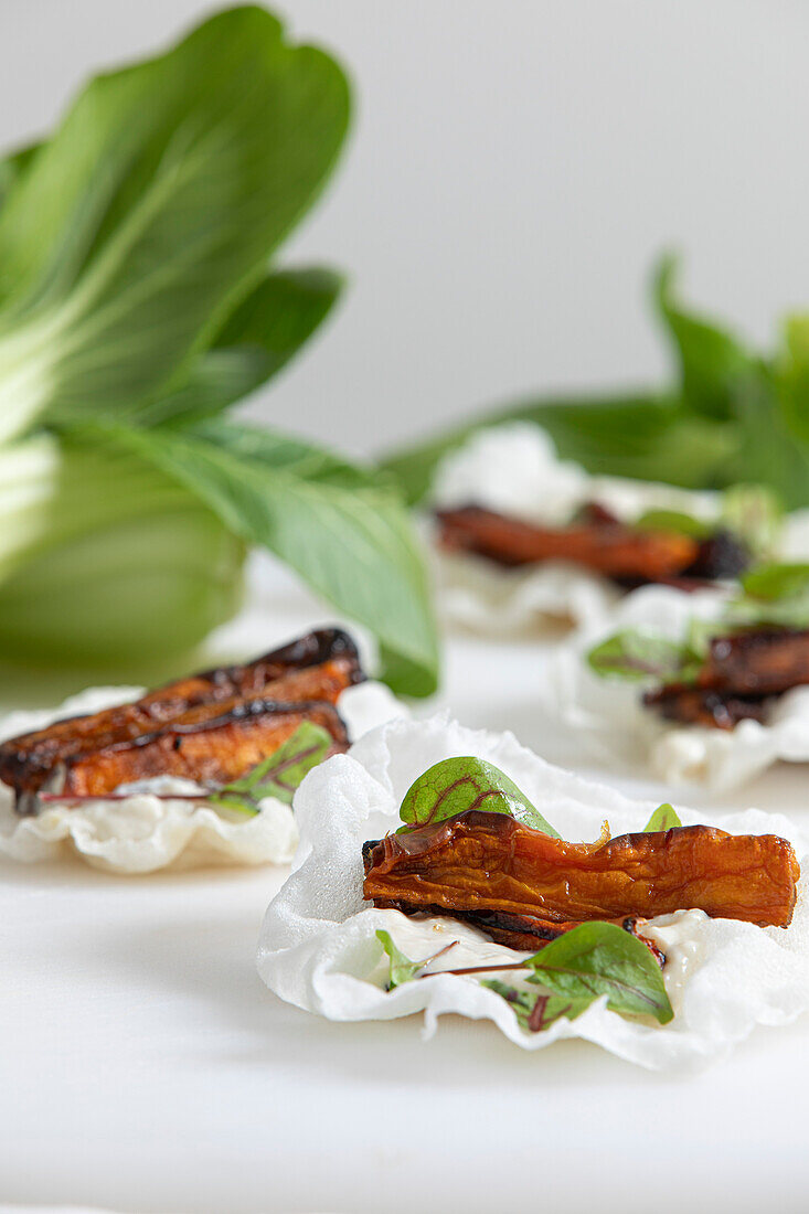 Rice paper taco with whipped tofu, smoked parsnip tofu, smoked parsnips