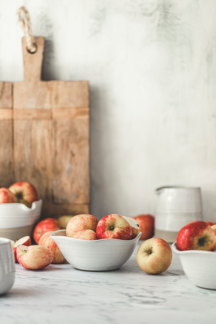 Apples on a marble table in a kitchen