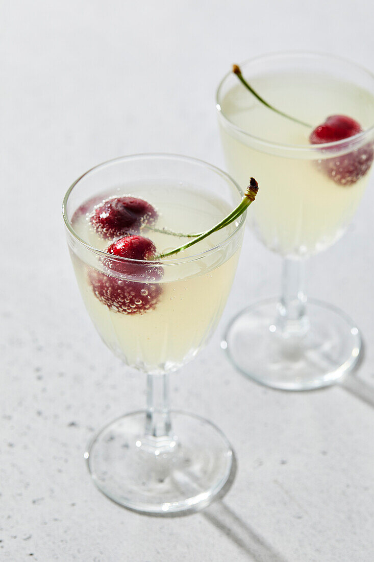Lemon sparkling water with cherries