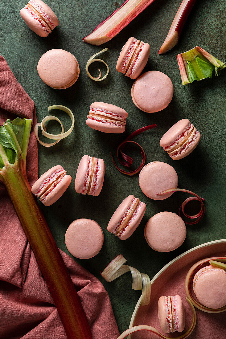 Rhubarb macarons on a green background