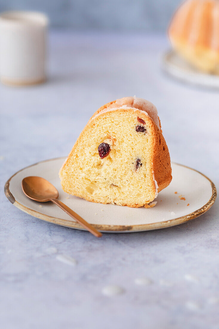 A slice of circular Citrus Bundt Cake