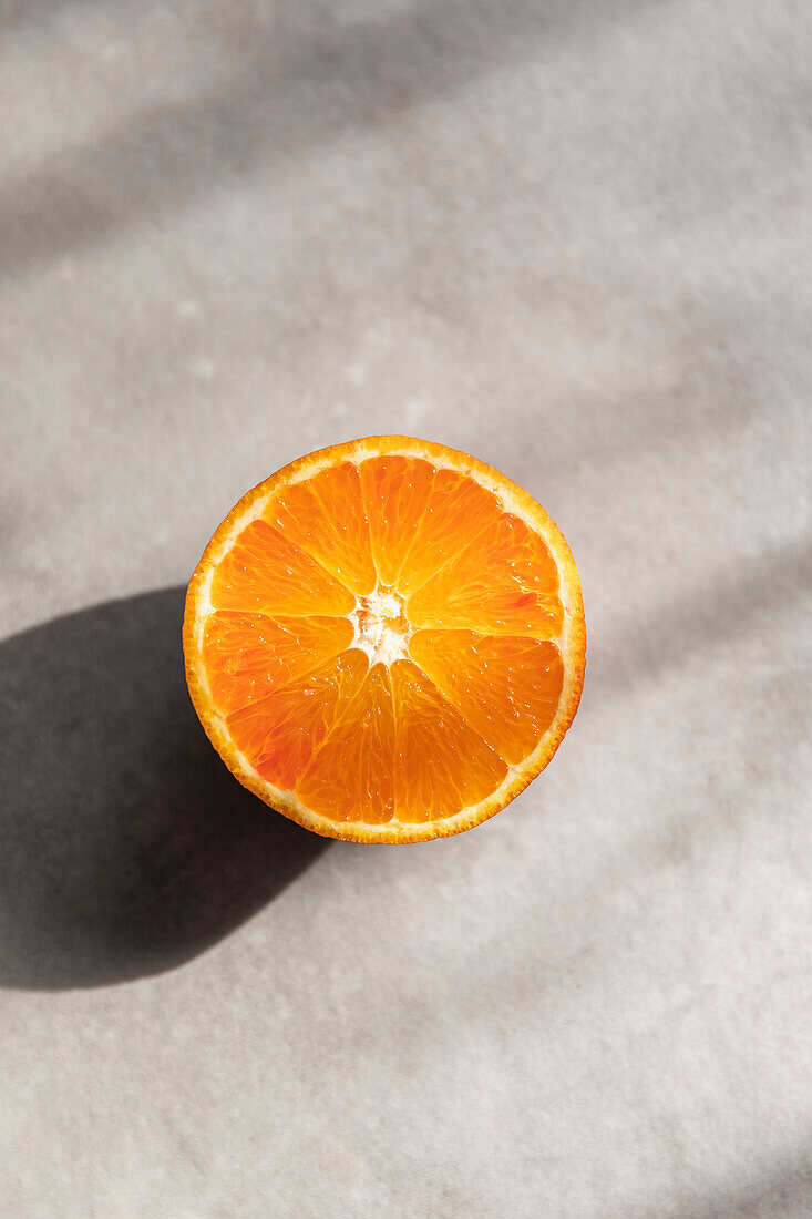 Slice of blood orange in the sunlight