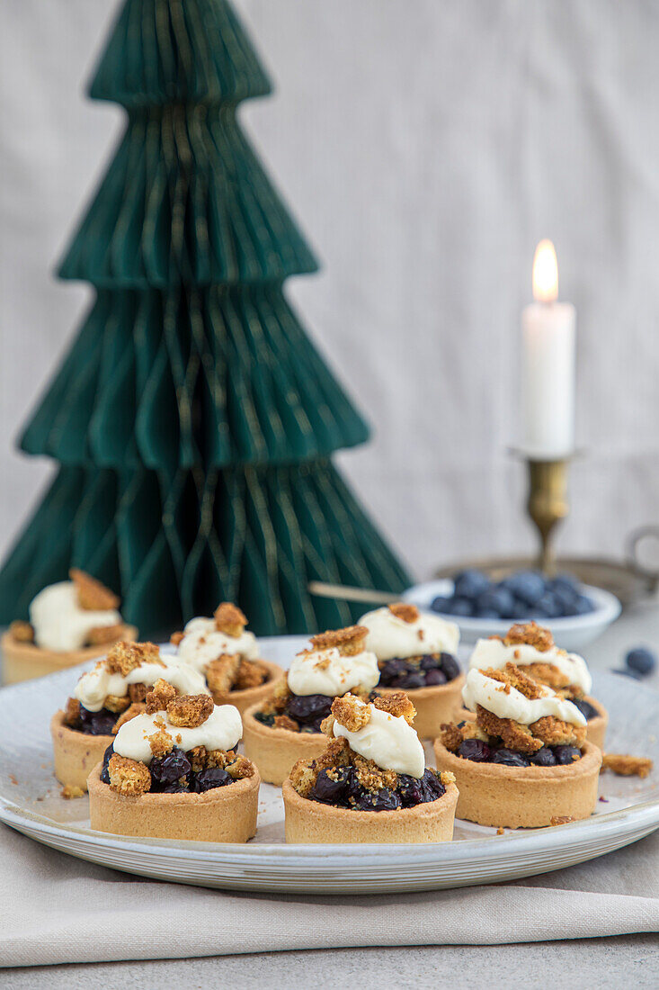 Christmas berry tarts on a plate
