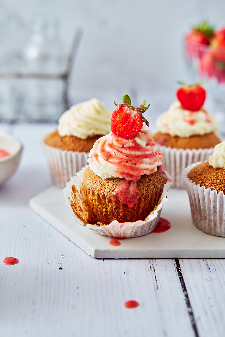 Strawberry cupcakes with cream cheese icing and coulis