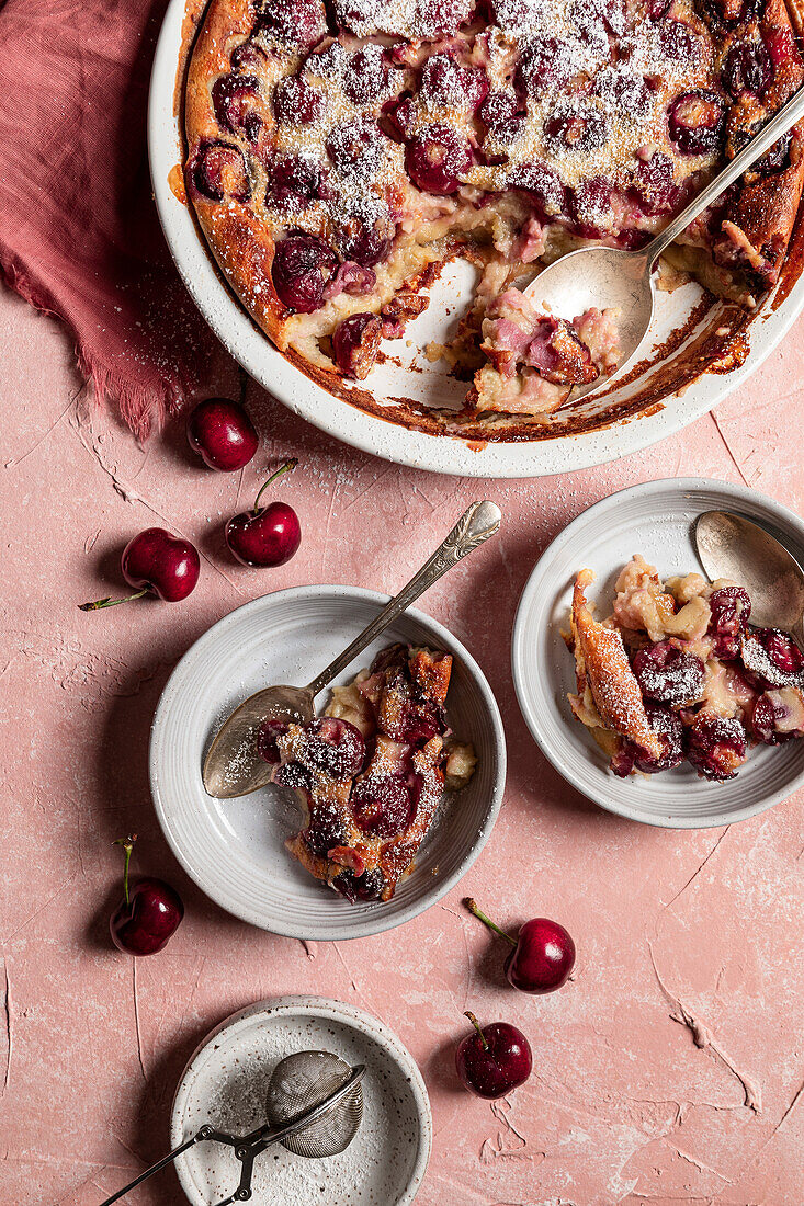 Cherry clafoutis on a pink background