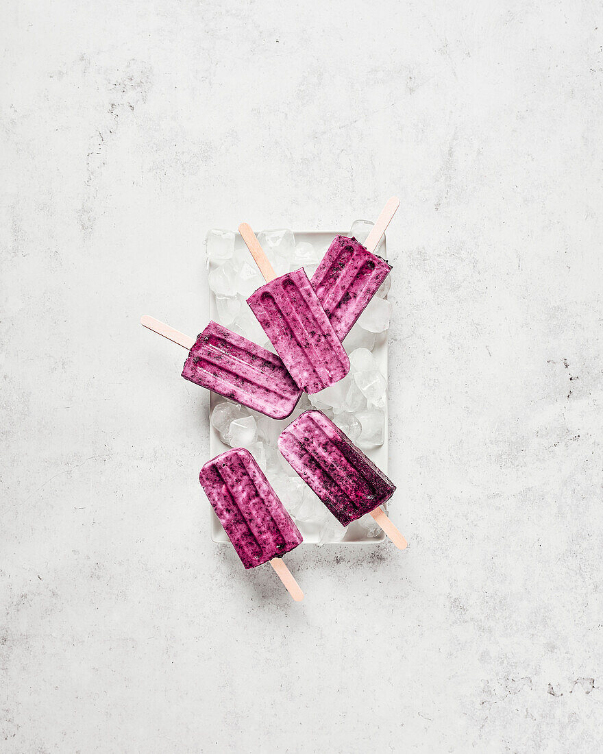 Vegan cherry and coconut ice cream on a white plate