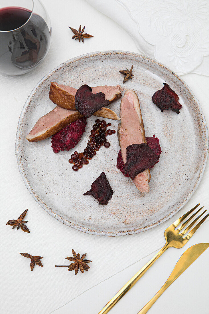 Duck balsamic pearls with beetroot puree and beetroot crisps