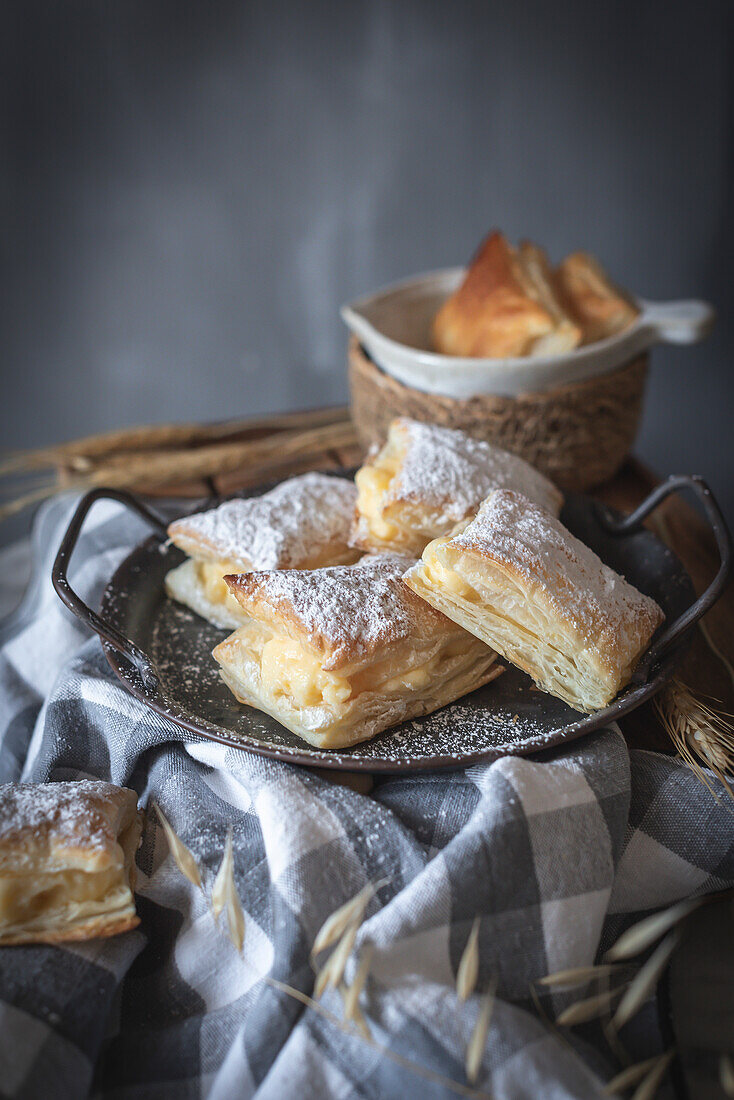 Vanilla cream puff pastries on a grey background