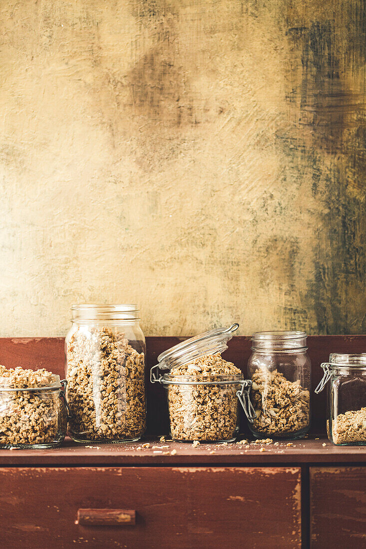 Homemade Granola in a jar on a rustic kitchen sideboard