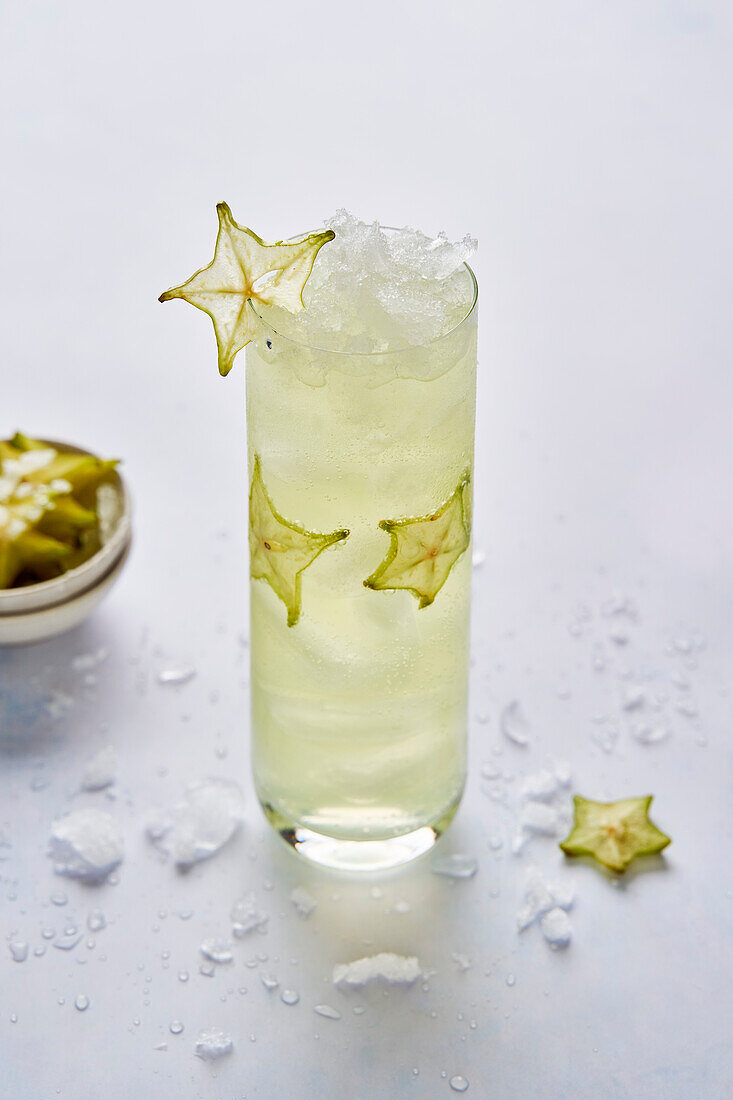 Starfruit cocktail drink with ice
