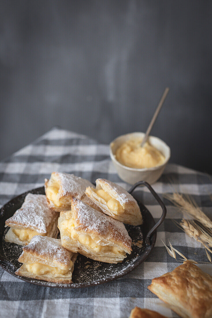 Vanilla cream puff pastry on a grey background