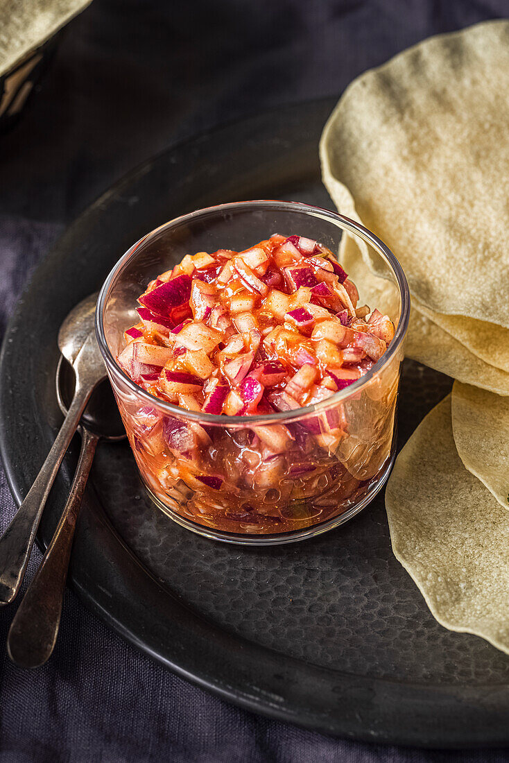 Red onion chutney served with poppadoms