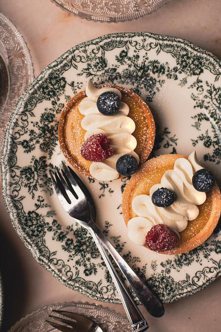 Lemon curt tartlet on a decorative plate