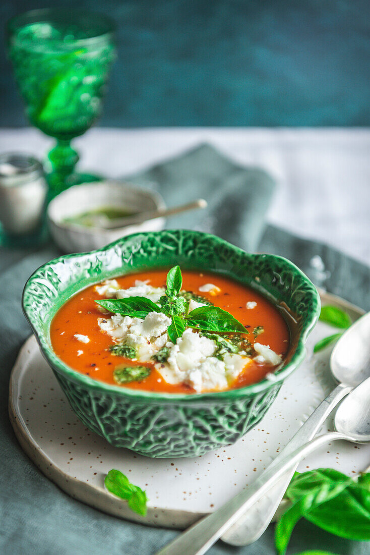 Roasted tomato soup with goat cheese in a cabbage-shaped bowl