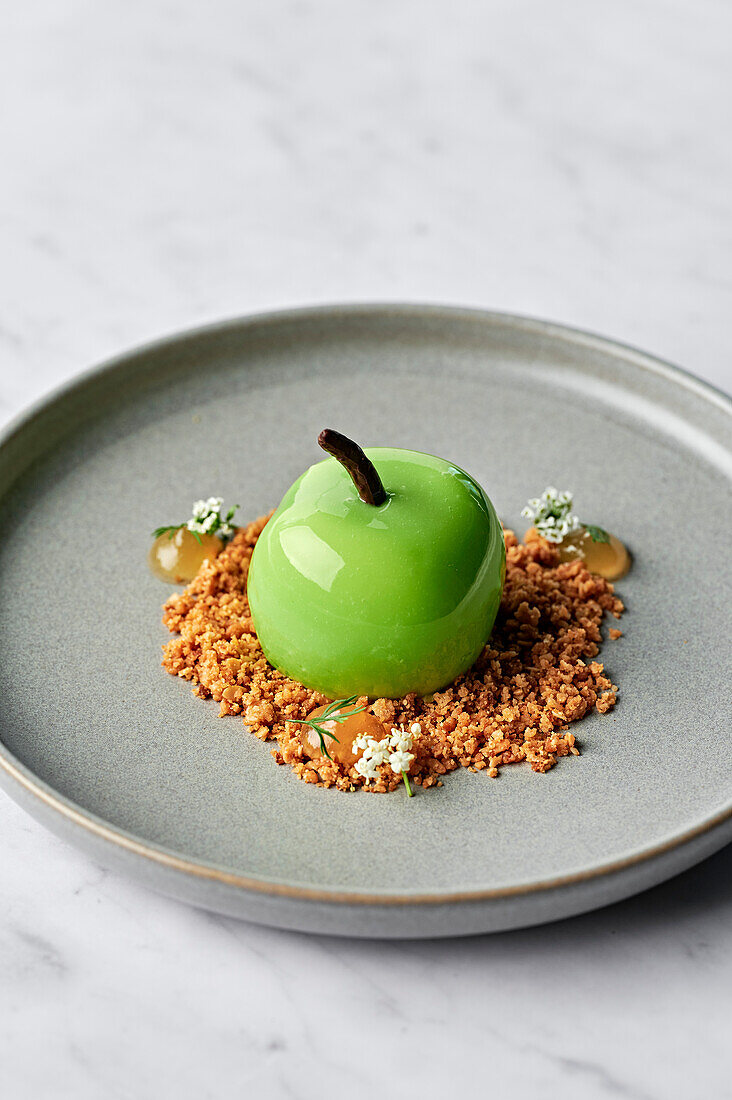 Dessert made from green apples, served with salted oat crumble and apple gel